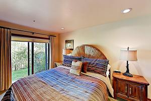 a bedroom with a large bed and a window at Lakeside Adventure in Park City