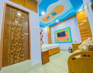 a room with a room with a bed and a door at Hotel As Shams International in Dhaka