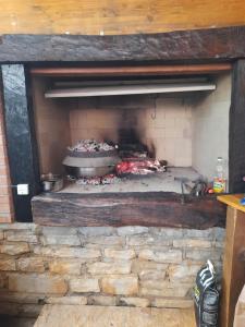 a brick oven with a cake in it at Bed and Breakfast Lovac in Kaldanija