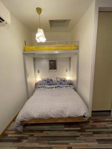 a bedroom with a bunk bed in a room at Le 9ième Entracte in Marseille