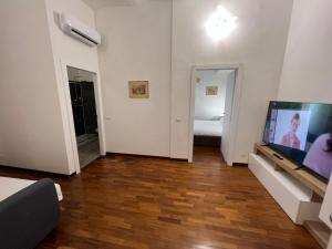 Televízia a/alebo spoločenská miestnosť v ubytovaní StarHome Colosseo
