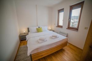 Voodi või voodid majutusasutuse Aria Club Wellness&Spa Zlatibor toas +37 fotot