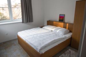 Voodi või voodid majutusasutuse Apartmány Kammergraf toas