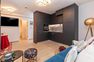 TV a/nebo společenská místnost v ubytování Perfect Downtown Apartment A217