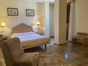 Postel nebo postele na pokoji v ubytování Hotel el Sol