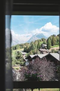 a view of a mountain from a window at Haus Bürchnerhof in Bürchen