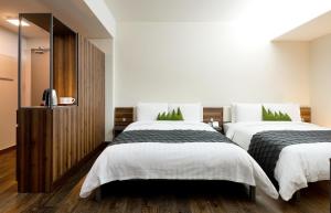 Postel nebo postele na pokoji v ubytování Metro Hotel Myeongdong