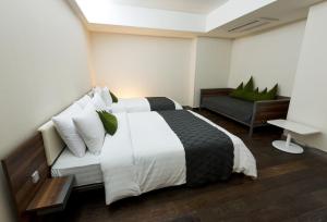 Postel nebo postele na pokoji v ubytování Metro Hotel Myeongdong