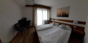Postel nebo postele na pokoji v ubytování Landhaus Weingut