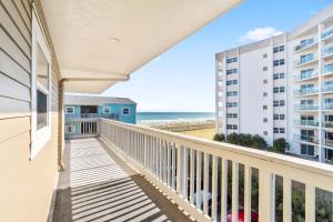 a balcony with a view of the ocean at Villas on the Gulf J6 in Pensacola Beach