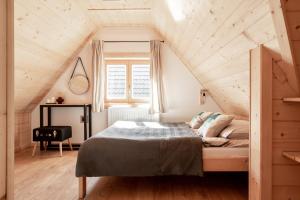 a bedroom with a bed in a attic at Dolina in Zakopane
