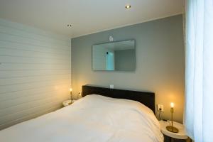 Ένα ή περισσότερα κρεβάτια σε δωμάτιο στο Chalet met loft - vakantiepark de Schreiershoek +25 φωτογραφίες