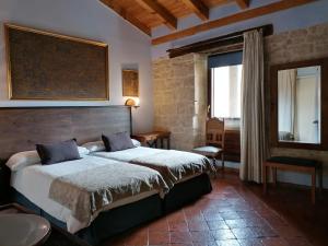 En eller flere senge i et værelse på palacio de Orisoain