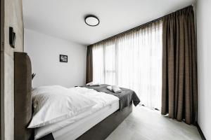 Posteľ alebo postele v izbe v ubytovaní PLATiNIUM HOUSE & SPA BASEN-SAUNA CENTRUM + 27 fotografií