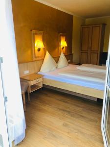 Postel nebo postele na pokoji v ubytování Landhaus Schönfelder Hof