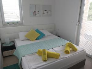 En eller flere senger på et rom på Apartment Adrijana