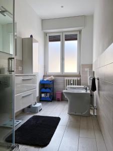 a bathroom with a tub and a sink and a mirror at The Lighthouse - Central Apartment Aosta - cir 0234 in Aosta