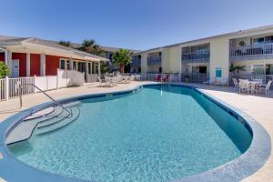 a large swimming pool in front of a building at Villas on the Gulf J6 in Pensacola Beach