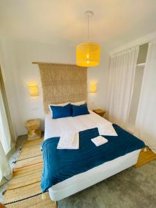 Uma cama ou camas num quarto em Villa Sal - Alvor