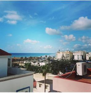 a view of the ocean from the roof of a building at APARTAMENTOS ALBATROS in Asilah