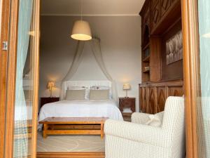 “Casa Amélie” tesisinde bir odada yatak veya yataklar