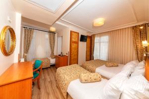 Postel nebo postele na pokoji v ubytování Santa Ottoman Hotel
