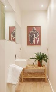 a bathroom with a sink and a mirror at Villa Loretopea by FeelFree Rentals in San Sebastián