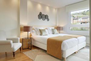 Posteľ alebo postele v izbe v ubytovaní Villa Loretopea by FeelFree Rentals
