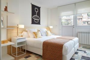 מיטה או מיטות בחדר ב-Villa Loretopea by FeelFree Rentals