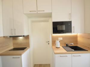 Kuchyň nebo kuchyňský kout v ubytování Apartment Anna-2 by Interhome + 14 fotografií