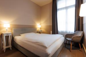 En eller flere senger på et rom på Hotel Emmental