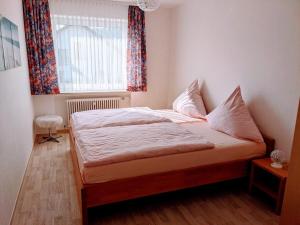 Postel nebo postele na pokoji v ubytování Haus Am Battenstein