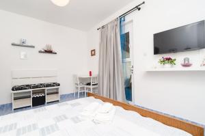 TV a/nebo společenská místnost v ubytování Apartments Vera