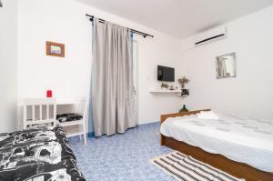 Postel nebo postele na pokoji v ubytování Apartments Vera