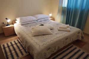 Postel nebo postele na pokoji v ubytování Apartments Vera