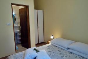 Postel nebo postele na pokoji v ubytování Apartments Vera