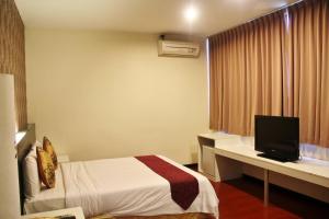 Postel nebo postele na pokoji v ubytování Prince Hotel