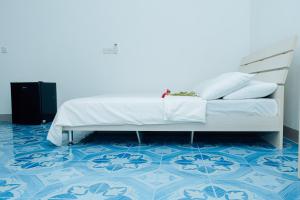 Postel nebo postele na pokoji v ubytování Riyaludhathuru Maldives