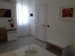 Postel nebo postele na pokoji v ubytování Porto Cesareo Hotel