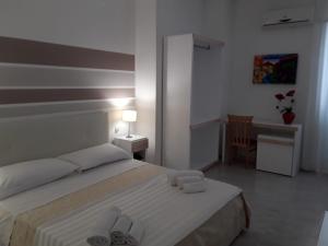 Postel nebo postele na pokoji v ubytování Porto Cesareo Hotel