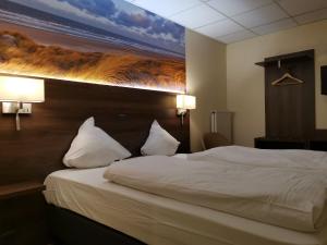 Postel nebo postele na pokoji v ubytování Hotel Albert II Oostende
