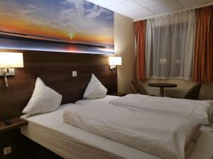 Postel nebo postele na pokoji v ubytování Hotel Albert II Oostende