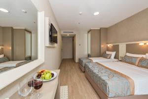 Postel nebo postele na pokoji v ubytování Marcello Hotel