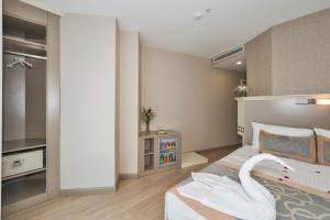 Postel nebo postele na pokoji v ubytování Marcello Hotel