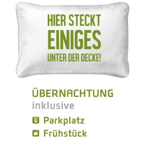 a pillow with the words her sick enemies under der der der der der der der at numberOne Hotel in Nuremberg