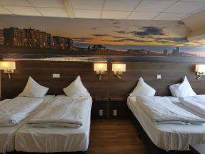 Postel nebo postele na pokoji v ubytování Hotel Albert II Oostende