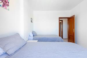 Posteľ alebo postele v izbe v ubytovaní Townhouse Calahonda