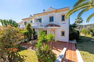 Vonkajšia záhrada v ubytovaní Townhouse Calahonda