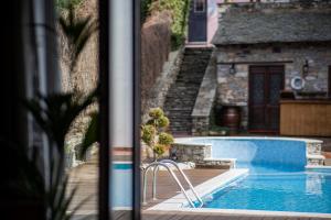 The swimming pool at or close to Archontiko Naoumidi