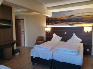 Postel nebo postele na pokoji v ubytování Hotel Albert II Oostende